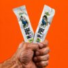 bodybuilder holding 2 sticks of m_pre samples
