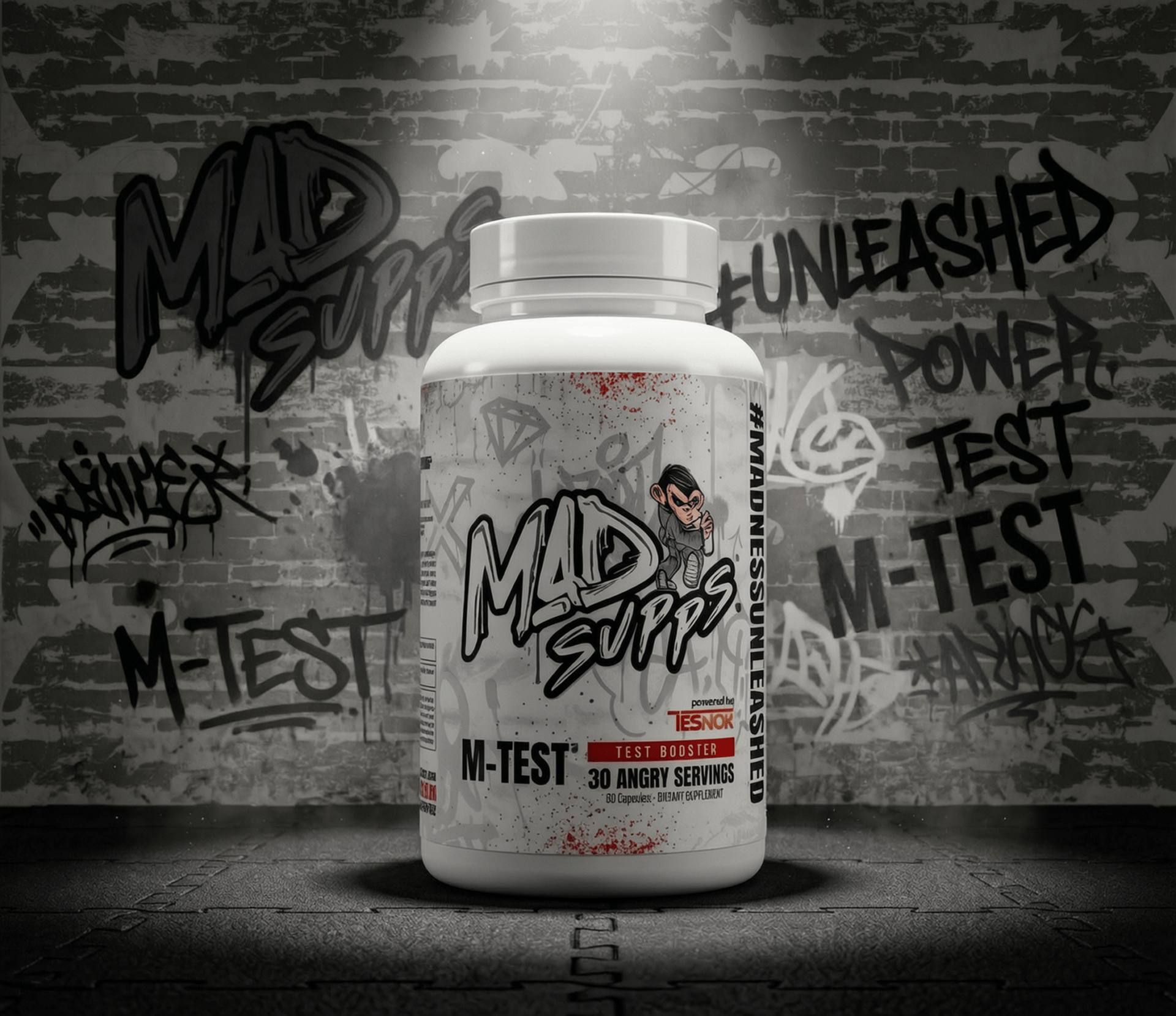 White bottle with graffiti-covered wall background, labeled M-TEST, a test booster supplement.