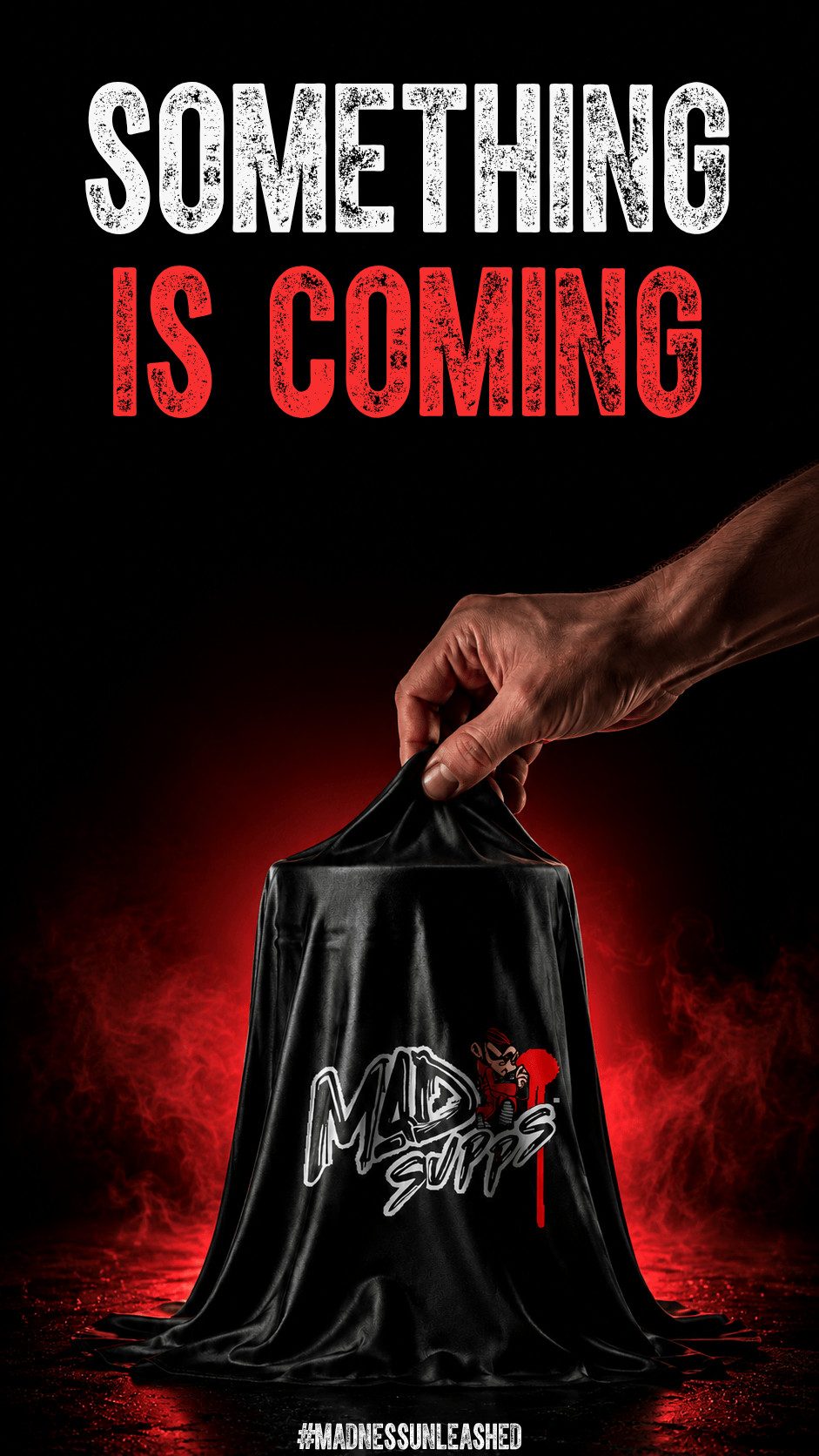 Poster announcing 'Something is Coming' with a hand lifting a black cloth to reveal a logo and red glow behind; conveys mystery or upcoming event.
